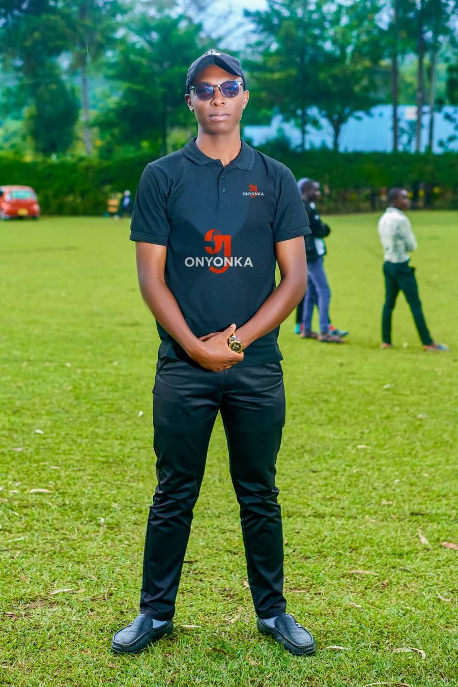 Onyonka J.M, SEO expert in Kenya, wearing an ONYONKA branded black polo shirt